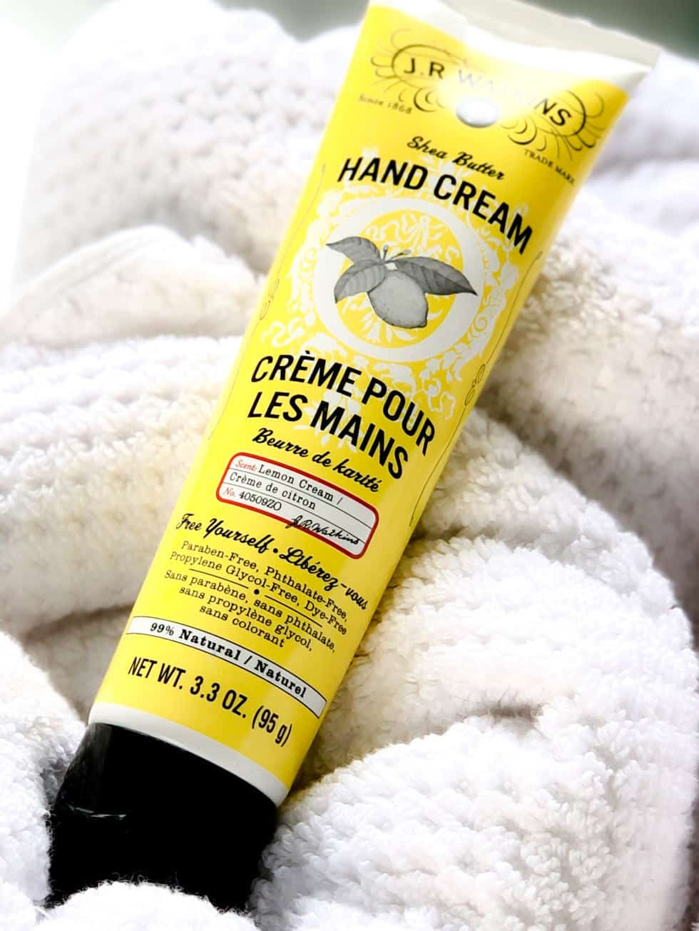 J.R. Watkins Lemon Cream on top of white towels