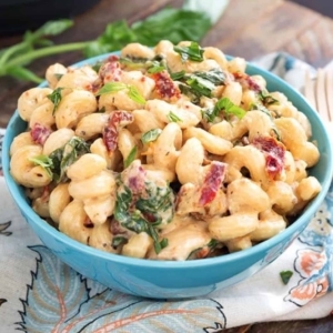 a large serving of tuscan chicken pasta in a small bowl