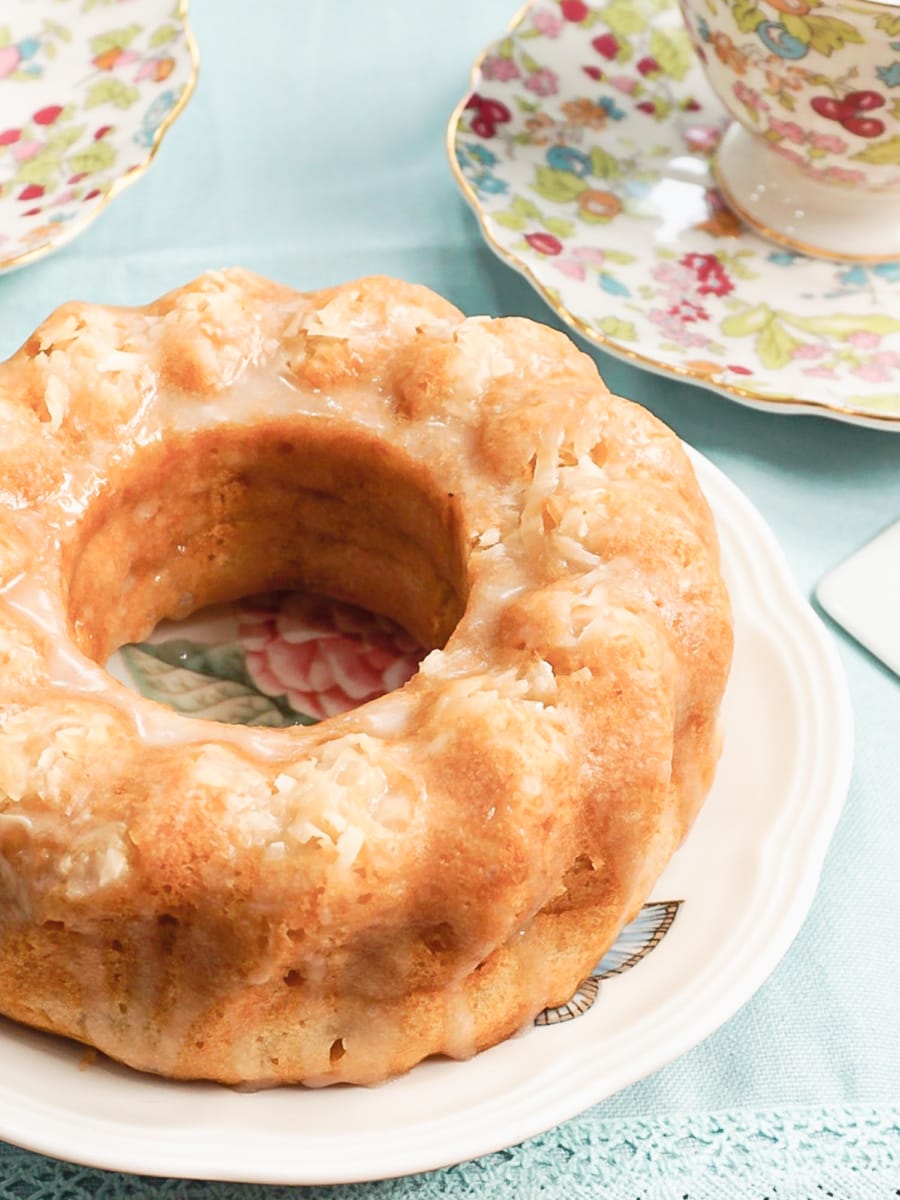 a coconut bundt cake sitting on a plate