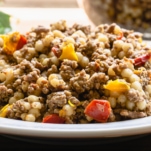 side view of couscous with ground beef on a plate