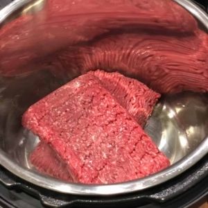 adding ground beef to the instant pot