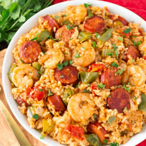 overhead shot of a bowl of jambalaya garnished with bits of cilantro