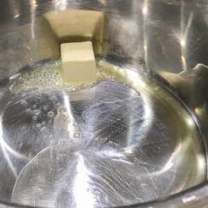 heating butter in oil helps prevent if from burning