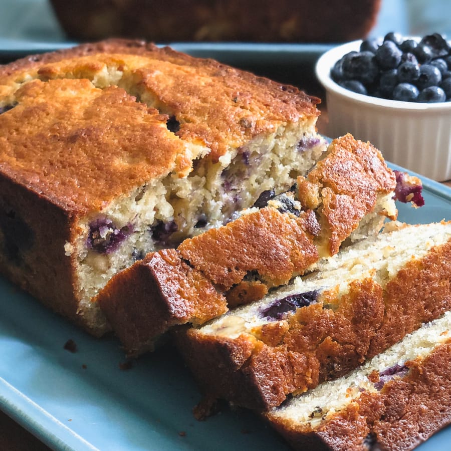 a sliced loaf of blueberry banana bread