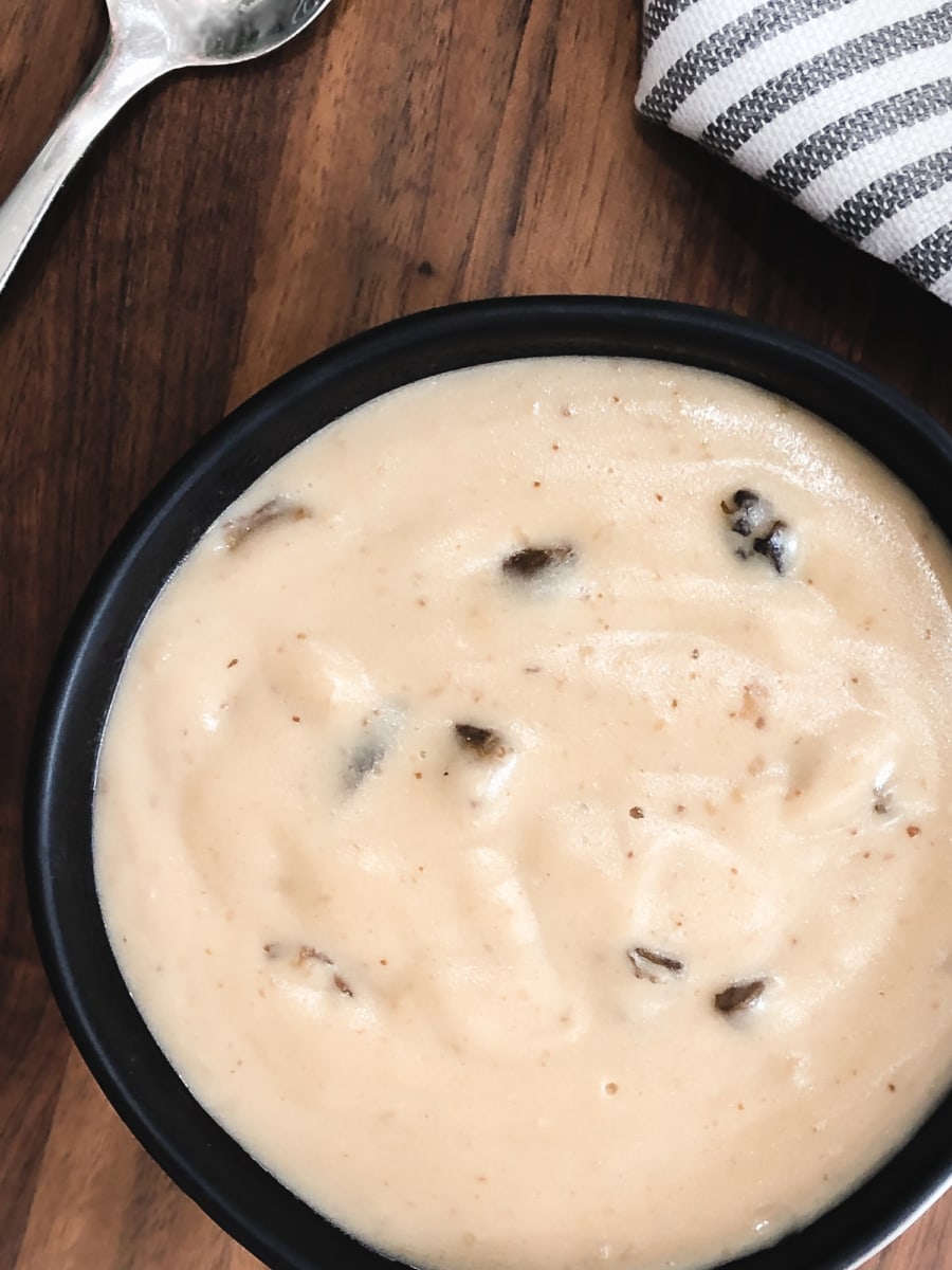 overhead shot of cream of mushroom soup in a bowl