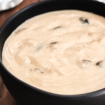 side view of cream of mushroom soup in a bowl