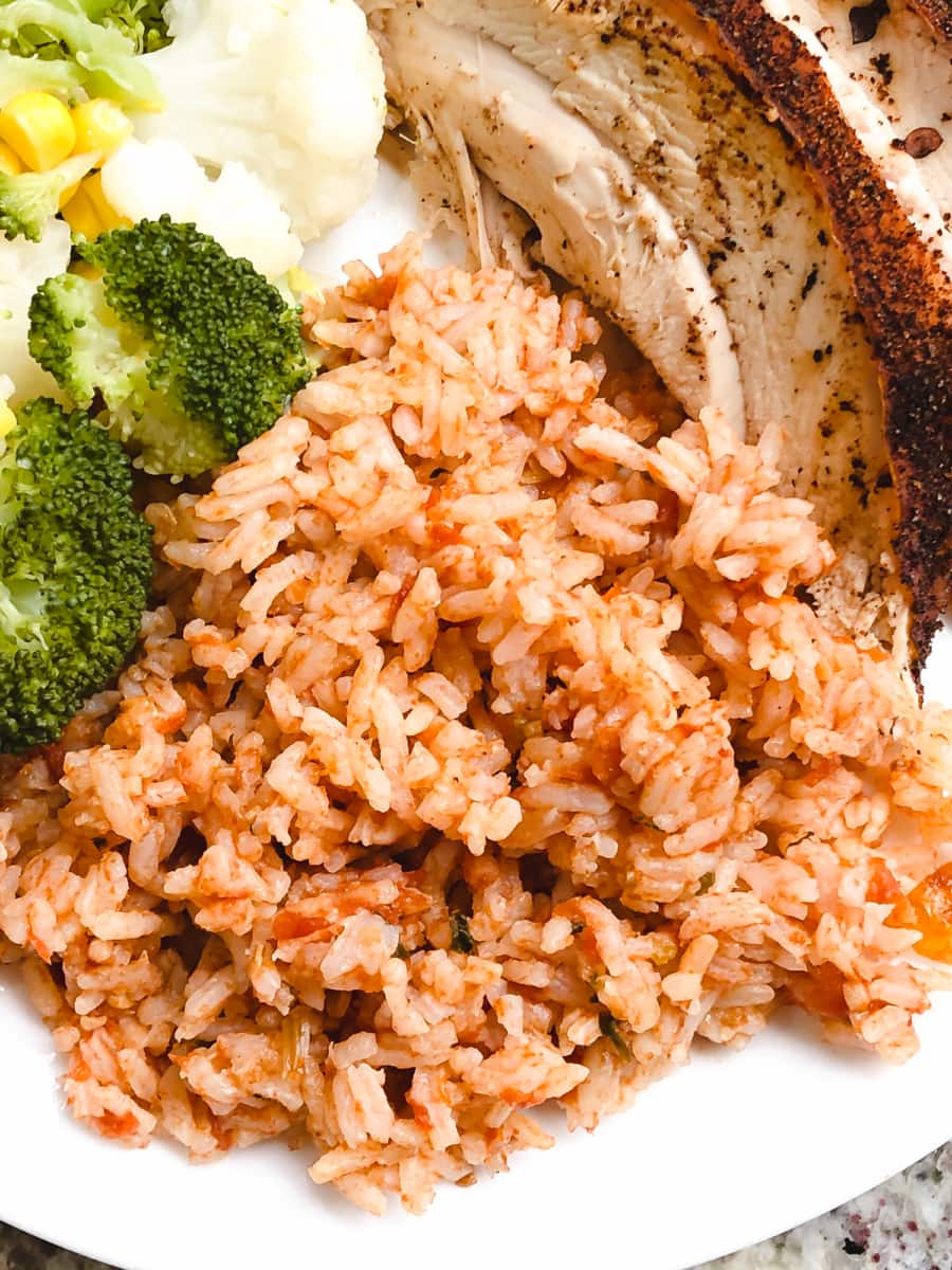 overhead shot of salsa rice on a dinner plate