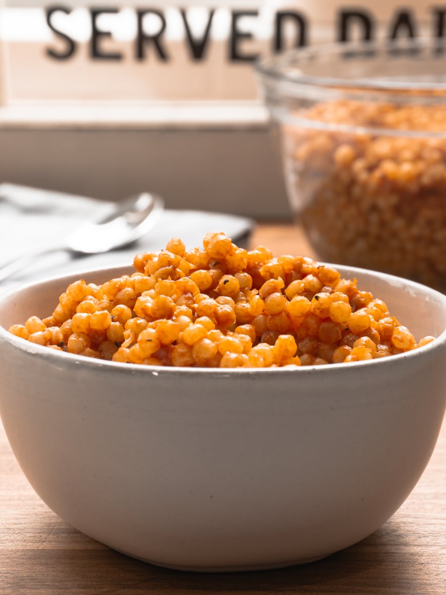 side view of tomato couscous in a large bowl