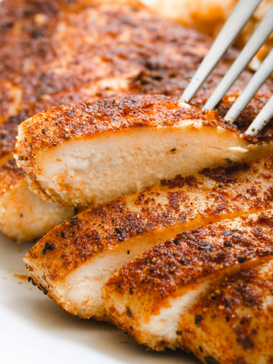 close up of a slice of a baked mexican chicken breast