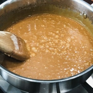 cooking a sugar mixture until it become toffee