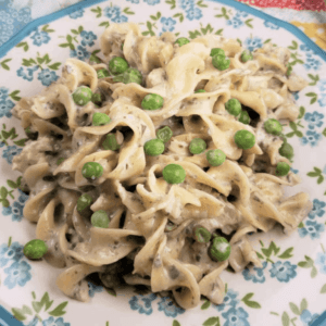 a large plate with tuna casserole with peas