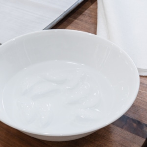 bowl of ice water for rolling cookie dough balls