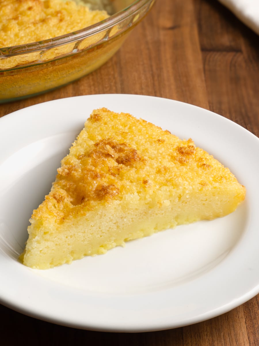 a slice of crustless buttermilk pie on a small plate