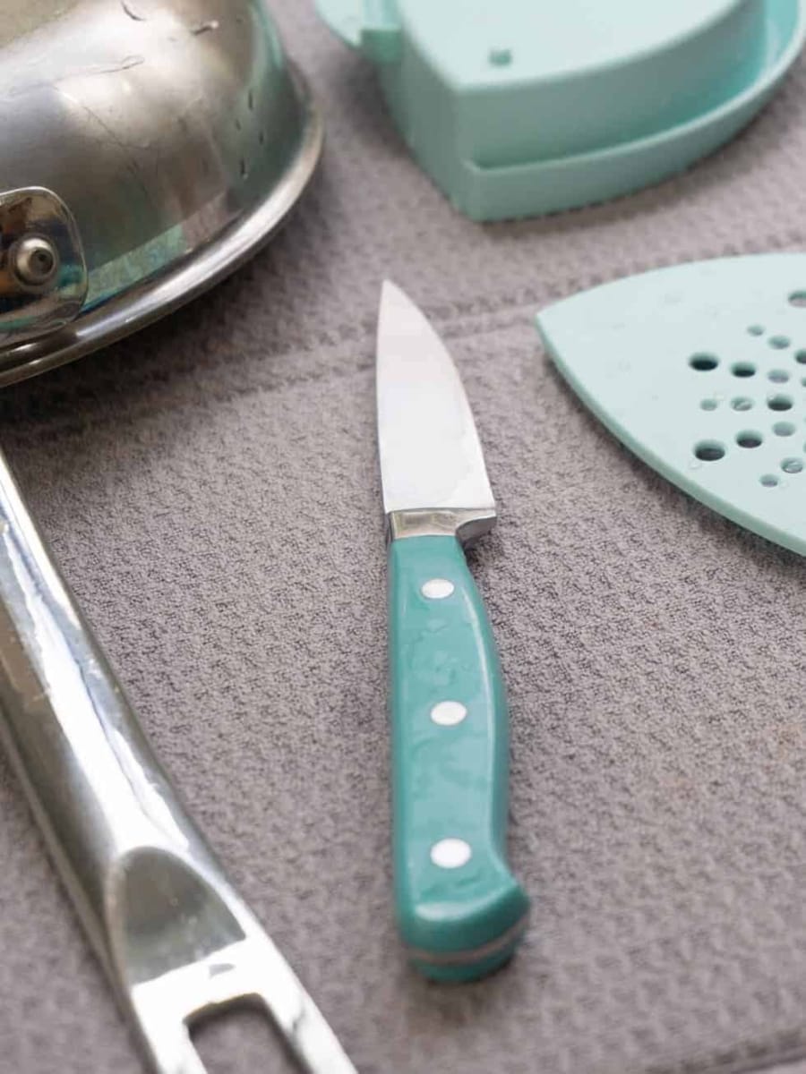 washing and drying dishes on a drying mat