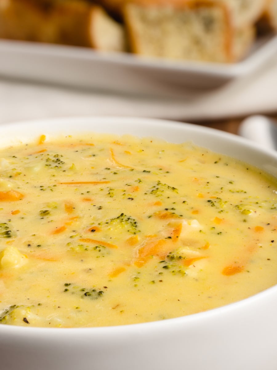 close up shot of broccoli cheddar soup in a bowl