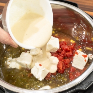 adding cornflour slurry to the instant pot for making white chicken chili