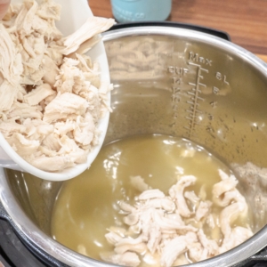 adding shredded chicken to the instant pot