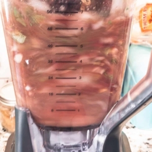 blending beans and vegetables with bean broth in the ninja blender