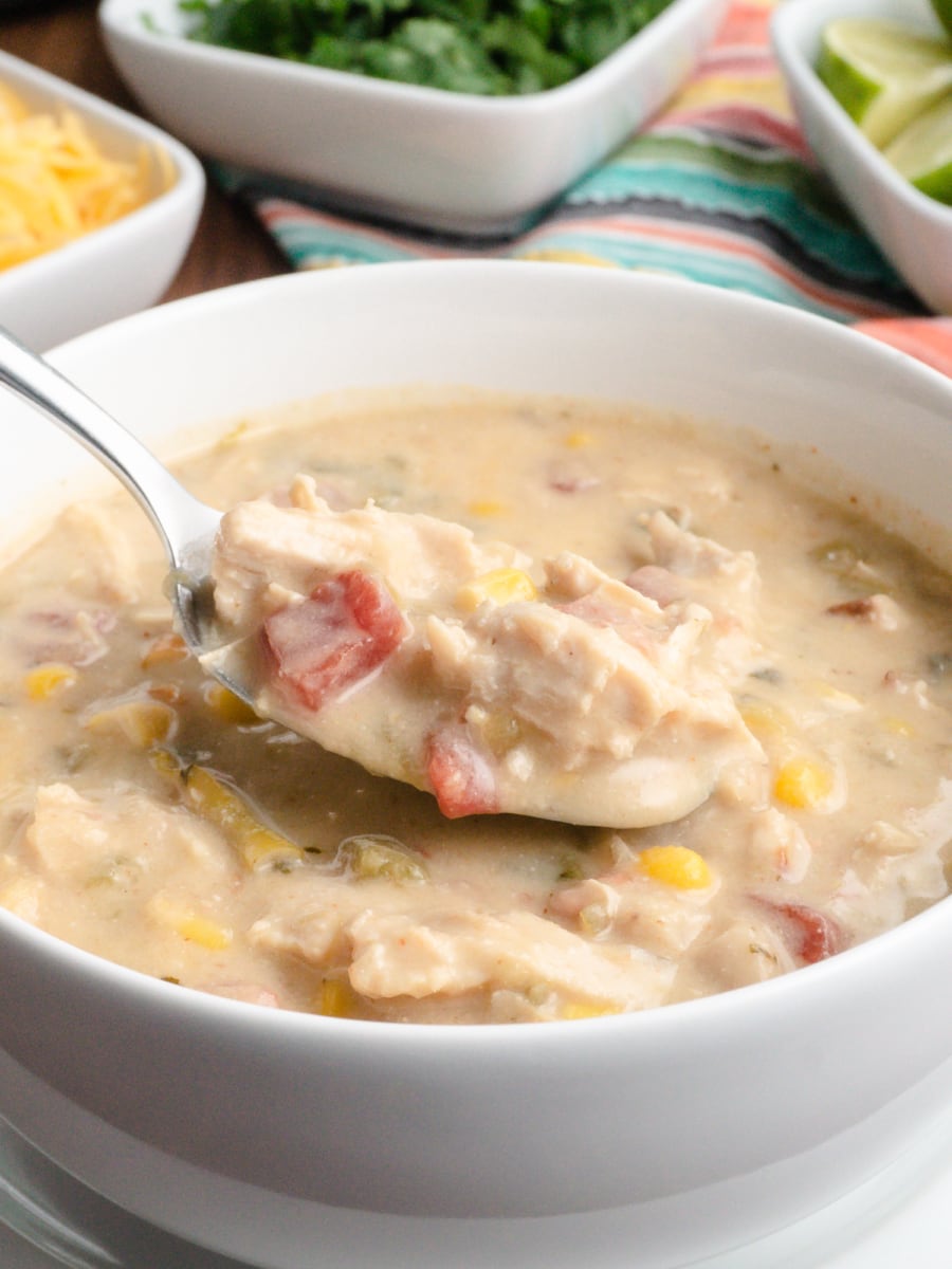 a spoonful of white chicken chili from a bowl