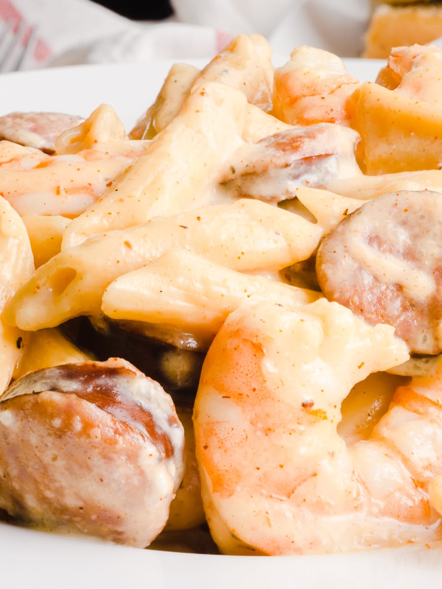 close up of a creamy plate of instant pot cajun shrimp alfredo with sausage