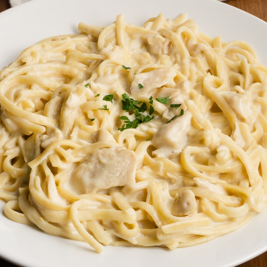 a bowl of creamy fettuccine alfredo with chicken