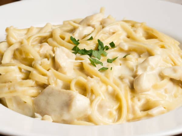 close up of a creamy bowl of instant pot chicken fettuccine alfredo