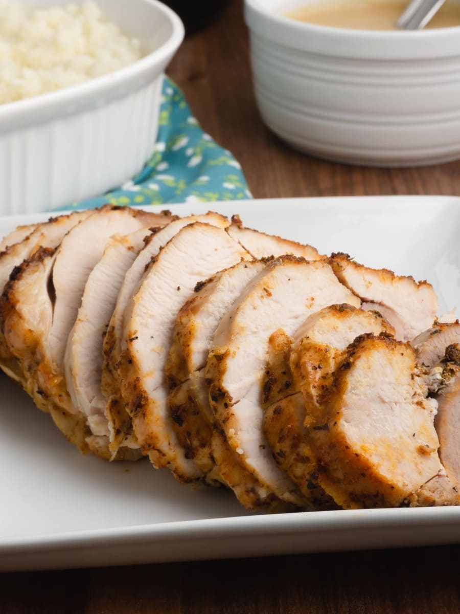 sliced instant pot turkey roast on a white platter