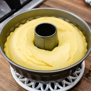 a large bundt pan with a lemon cake that was cooked in the instant pot pressure cooker