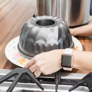 unmolding a bundt cake onto a large plate