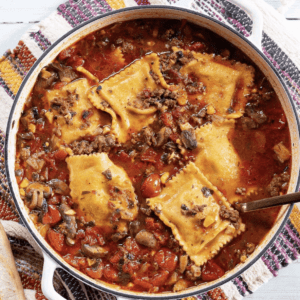 overhead shot of ravioli soup in a large pot