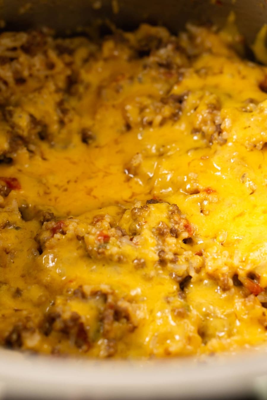 melted cheese over a ground beef and rice casserole made in the instant pot