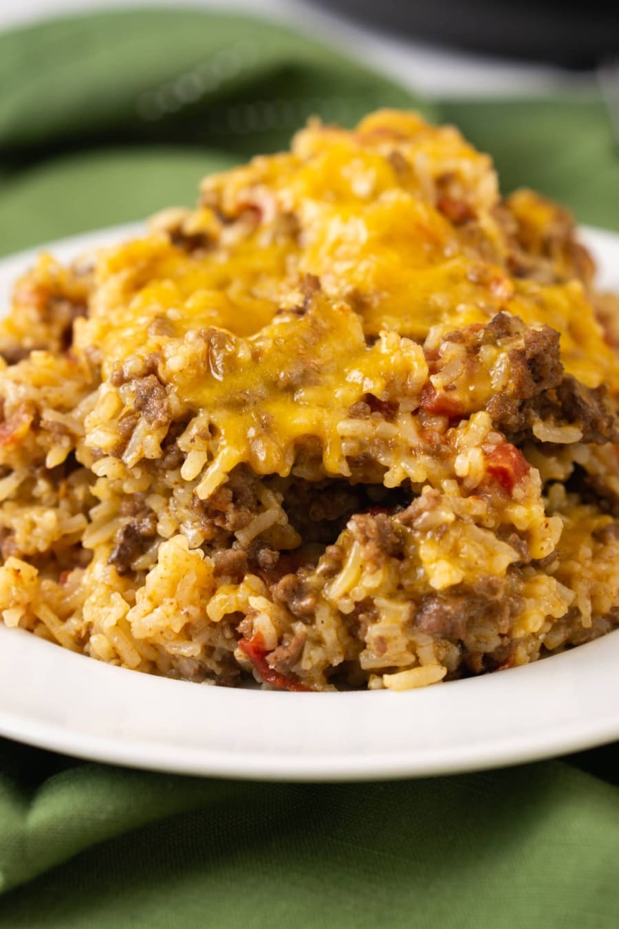 a plate of cheesy ground beef and rice casserole