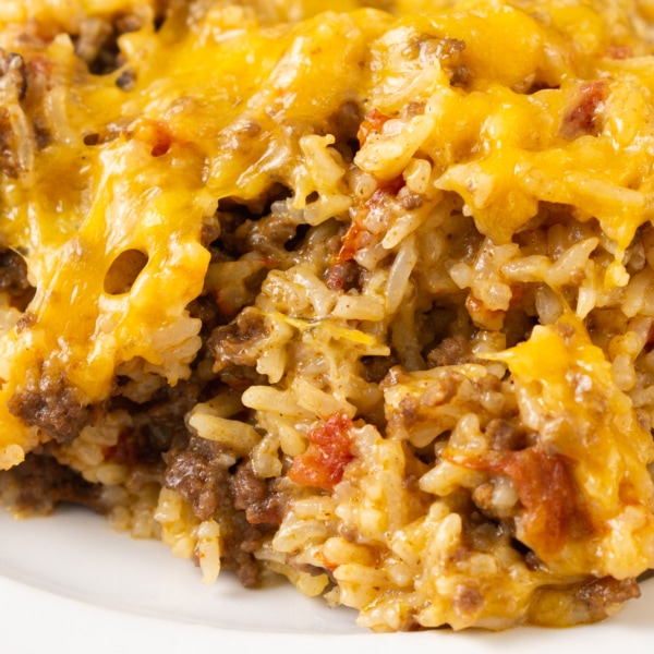 a large serving of cheesy ground beef and rice on a plate