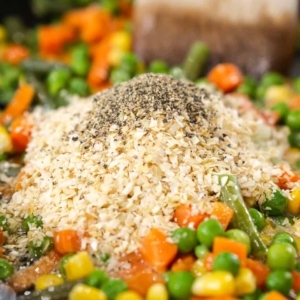 adding a homemade fried rice seasoning to vegetables