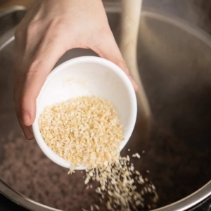 adding dried minced onions to the instant pot to make chili