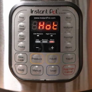 adjusting the instant pot saute heat to more for cooking tuscan chicken