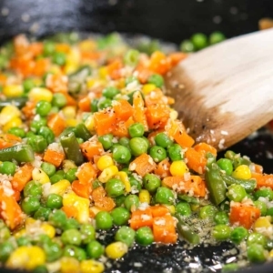 cooking frozen vegetables to make an easy homemade fried rice