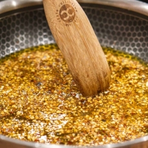 a large skillet with olive oil, dry minced onion, dry minced garlic, red pepper flakes, and salt to make spicy spaghetti aglio e olio