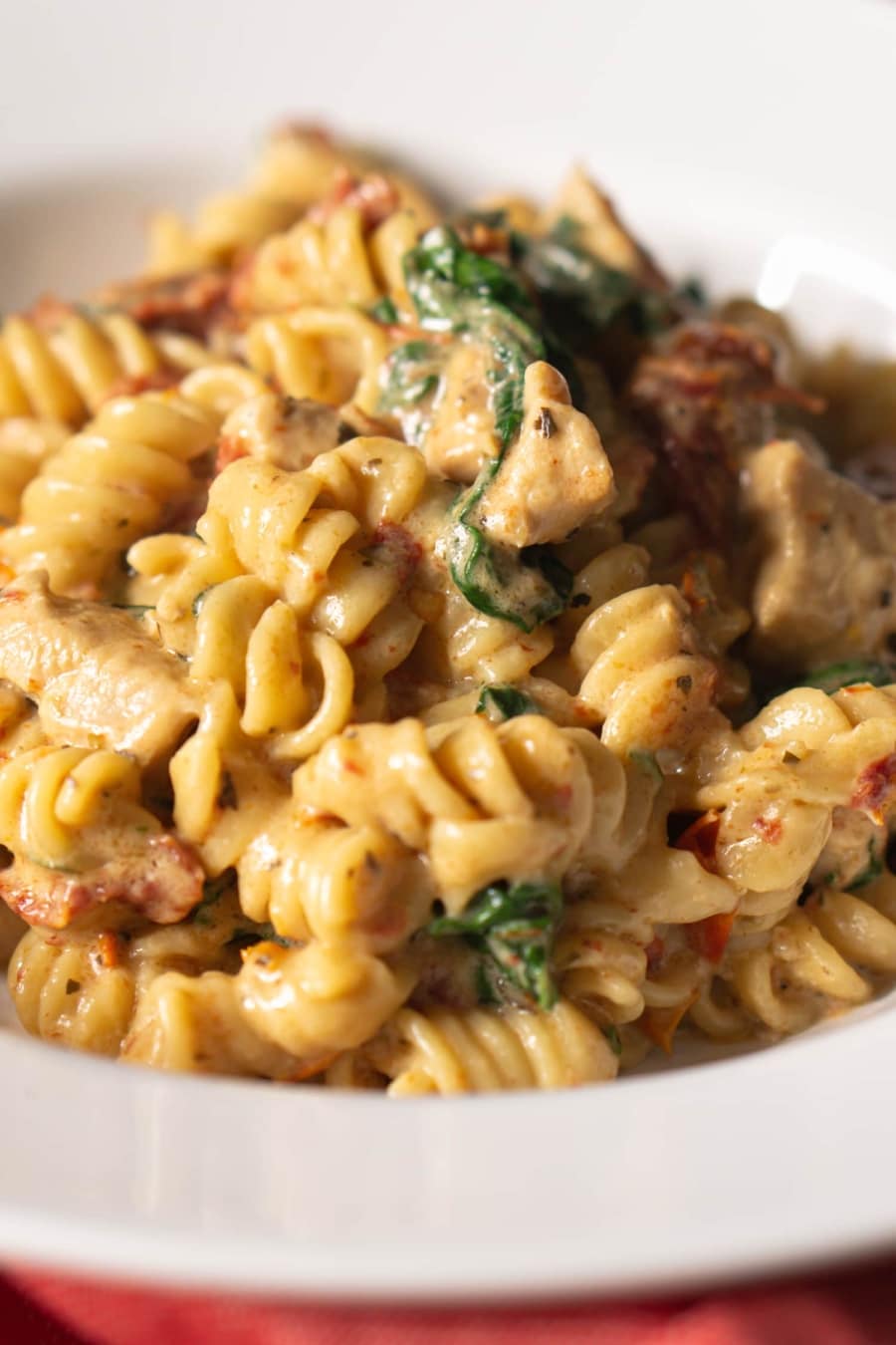 tuscan chicken pasta served on a plate