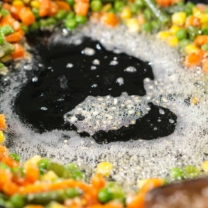 clear the middle of a skillet by pushing the vegetables up against the sides before adding eggs