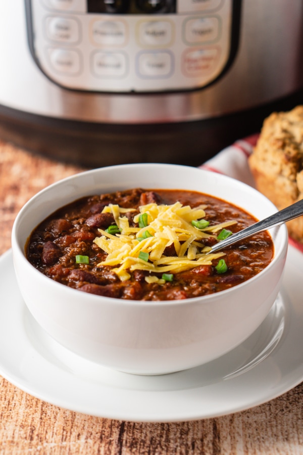a bowl of perfect homemade instant pot chili topped with shredded cheese