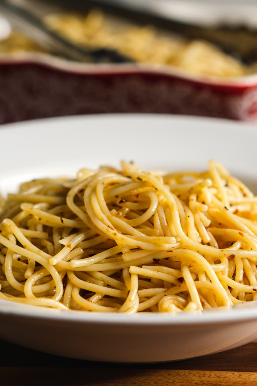 a plate of spicy pasta with olive oil and chili pepper, garlic, and onion