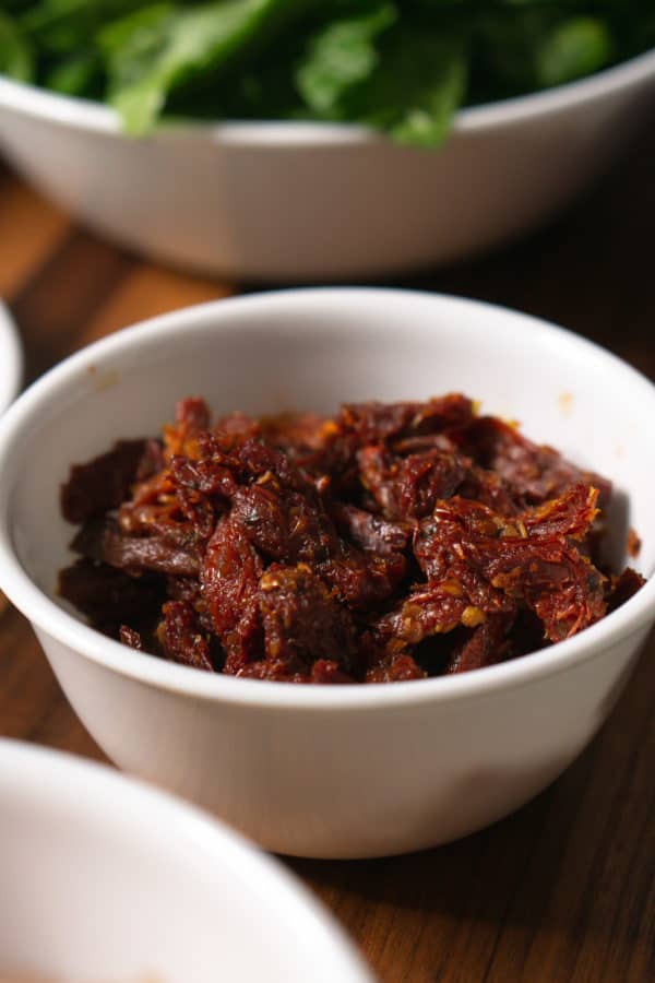 a small bowl of sun-dried tomatoes for making tuscan chicken pasta