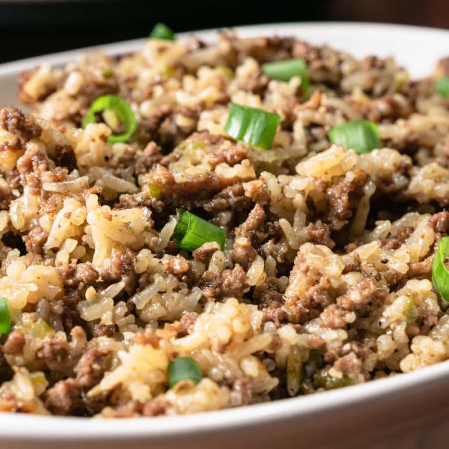 a close up of a dish with dirty rice