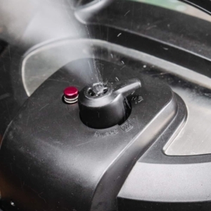 releasing the remaining pressure from the instant pot pressure cooker by setting the pressure release valve to venting