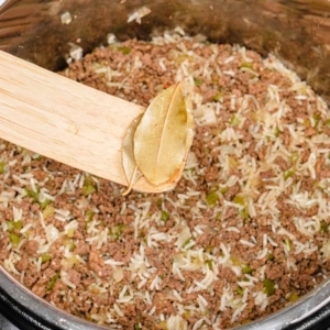 removing bay leaves from the instant pot using a wooden spurtle