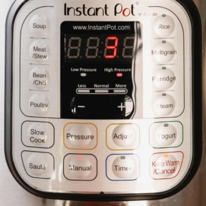 the instant pot digital display reading 3 during a 3 minute pressure cook