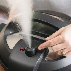 flipping the pressure release valve on the instant pot to the venting position