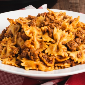 a bowl of beef and bowtie pasta