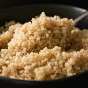 quinoa being spooned out of a bowl